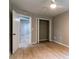 Well-lit bedroom with wood-look floors and double-door closet at 788 Fayetteville Se Rd, Atlanta, GA 30316