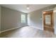 Bedroom with fan, wood-look floors, closet, and lots of natural light at 788 Fayetteville Se Rd, Atlanta, GA 30316