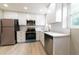 Modern, well-lit kitchen with stainless steel appliances and white cabinets at 788 Fayetteville Se Rd, Atlanta, GA 30316