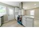 Bright kitchen with white cabinets, stainless steel appliances, and wood flooring at 788 Fayetteville Se Rd, Atlanta, GA 30316