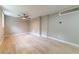 Large living room with ceiling fan, wood-look floors, and neutral colored walls at 788 Fayetteville Se Rd, Atlanta, GA 30316