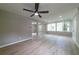 Spacious living room showcases a ceiling fan, hardwood floors, and abundant natural light at 788 Fayetteville Se Rd, Atlanta, GA 30316