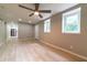 Spacious living room featuring stylish ceiling fan, wood-look flooring, and lots of light at 788 Fayetteville Se Rd, Atlanta, GA 30316