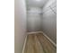 Walk-in closet with wood-look flooring and wire shelving at 788 Fayetteville Se Rd, Atlanta, GA 30316