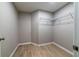 Walk-in closet with wire shelving and wood-look flooring at 788 Fayetteville Se Rd, Atlanta, GA 30316