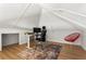 Finished attic space with hardwood floors, a desk, and unique architectural details at 2647 Forrest Nw Ave, Atlanta, GA 30318