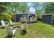 Spacious backyard featuring a fire pit, patio, deck and a shed, perfect for outdoor enjoyment at 2647 Forrest Nw Ave, Atlanta, GA 30318