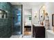 A contemporary bathroom shows a glass shower, a dark vanity, and modern fixtures at 2647 Forrest Nw Ave, Atlanta, GA 30318