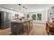Spacious kitchen with island offers granite countertops, stainless appliances, bar seating and an eat-in area at 2647 Forrest Nw Ave, Atlanta, GA 30318