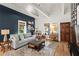 Well-appointed living room featuring a comfortable sofa, hardwood floors, and stylish decor elements at 2647 Forrest Nw Ave, Atlanta, GA 30318
