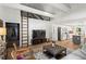 Cozy living area featuring a modern staircase, an open concept floorplan, and bright white walls at 2647 Forrest Nw Ave, Atlanta, GA 30318