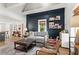 Comfortable living room featuring a gray sofa, hardwood floors, stylish decor, and plenty of natural light at 2647 Forrest Nw Ave, Atlanta, GA 30318