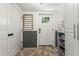 Mudroom with brick flooring, painted wainscoting, storage, and a door to the exterior of the home at 2647 Forrest Nw Ave, Atlanta, GA 30318