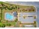 Aerial view of the community pool with ample parking, clubhouse, landscaped grounds, and other amenities at 3828 Ramsay Pass, Loganville, GA 30052