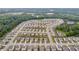 Areal view of Loganville, GA, highlighting a neighborhood with similar single-Gathering homes near a pond at 3828 Ramsay Pass, Loganville, GA 30052