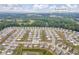 Well-planned community with homes nestled among mature trees and amenities, indicating a desirable living environment in Loganville, GA at 3828 Ramsay Pass, Loganville, GA 30052