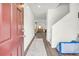 Inviting entryway with wood-look floors, white walls, and clear sightlines into the home's living spaces at 3828 Ramsay Pass, Loganville, GA 30052