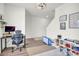 Bright office and playroom with desk, chair, playroom accessories and neutral paint at 3828 Ramsay Pass, Loganville, GA 30052