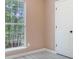 Bedroom features window, white door, neutral wall paint, and laminate flooring at 5805 Eagles Feather Ln, Riverdale, GA 30274