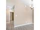 Living room with chandelier, laminate flooring, and a door to hall at 5805 Eagles Feather Ln, Riverdale, GA 30274