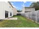 Fenced backyard with grass and concrete patio, perfect for outdoor relaxation and activities at 720 Mountain Laurel Dr, Canton, GA 30114