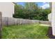 A well-maintained backyard with a wood fence and green grass at 720 Mountain Laurel Dr, Canton, GA 30114