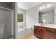 Bathroom features a soaking tub, walk-in shower, and vanity with ample counter space at 720 Mountain Laurel Dr, Canton, GA 30114