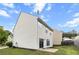 Back exterior of a home features siding, a sliding glass door and green grass at 720 Mountain Laurel Dr, Canton, GA 30114