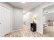 Hallway with neutral paint, patterned rug, and views of a bedroom and doorway at 720 Mountain Laurel Dr, Canton, GA 30114