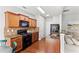 Well-equipped kitchen with granite countertops, dark cabinetry, and modern appliances at 720 Mountain Laurel Dr, Canton, GA 30114