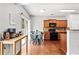 Cozy kitchen featuring wood cabinetry, stainless steel appliances, and an adjacent dining area at 720 Mountain Laurel Dr, Canton, GA 30114