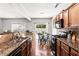 Updated kitchen features granite counters, stainless appliances, and an adjacent breakfast nook at 720 Mountain Laurel Dr, Canton, GA 30114