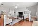 Bright living area with hardwood floors, neutral walls, and open layout connecting to the staircase at 720 Mountain Laurel Dr, Canton, GA 30114