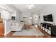 Comfortable living room with a plush sectional, hardwood floors, and a cozy atmosphere at 720 Mountain Laurel Dr, Canton, GA 30114