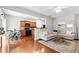 Open-concept living area with hardwood floors, gray walls, and a seamless flow into the kitchen space at 720 Mountain Laurel Dr, Canton, GA 30114