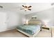 This main bedroom features a fan, carpet, and a light paint color at 720 Mountain Laurel Dr, Canton, GA 30114