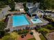 Aerial view of a community pool area featuring ample seating, a baby pool, and landscaping at 720 Mountain Laurel Dr, Canton, GA 30114