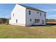Exterior view showcasing the white siding and well-manicured lawn at 116 Chattahoochee Cir, Locust Grove, GA 30248