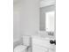 Bathroom showcasing single sink, white cabinets, and toilet for a clean, sleek design at 116 Chattahoochee Cir, Locust Grove, GA 30248