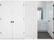 Hallway with hardwood floors and access to bath. Offers a practical design for easy access to bath and living areas at 116 Chattahoochee Cir, Locust Grove, GA 30248