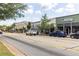 A charming street view with Blackrose Cafe and storefronts, showcasing local businesses at 116 Chattahoochee Cir, Locust Grove, GA 30248