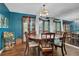 Elegant dining room showcasing wood floors, a round table, and tasteful decor at 3067 Nuptial Ln, Lawrenceville, GA 30044