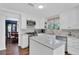 This kitchen boasts stainless appliances, granite countertops and an island with white cabinets at 3067 Nuptial Ln, Lawrenceville, GA 30044