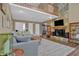 Spacious living room showcasing a stone fireplace, wood floors, and a comfortable gray sofa at 3067 Nuptial Ln, Lawrenceville, GA 30044