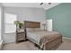 Spacious main bedroom with a large bed, side tables, and plenty of natural light at 3067 Nuptial Ln, Lawrenceville, GA 30044