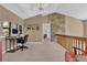 Upstairs office space showcasing a desk, chair, and views of the outdoor surroundings at 3067 Nuptial Ln, Lawrenceville, GA 30044
