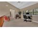 Bright upstairs office area featuring a desk, seating, and large windows at 3067 Nuptial Ln, Lawrenceville, GA 30044