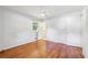 Bedroom features hardwood floors, two closets, neutral paint, and windows at 4074 Idlevale Dr, Tucker, GA 30084