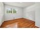 Bright bedroom featuring hardwood floors, a large window, and closet at 4074 Idlevale Dr, Tucker, GA 30084