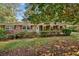 Charming single-story brick home featuring a covered carport, well-manicured landscaping, and inviting curb appeal at 4074 Idlevale Dr, Tucker, GA 30084